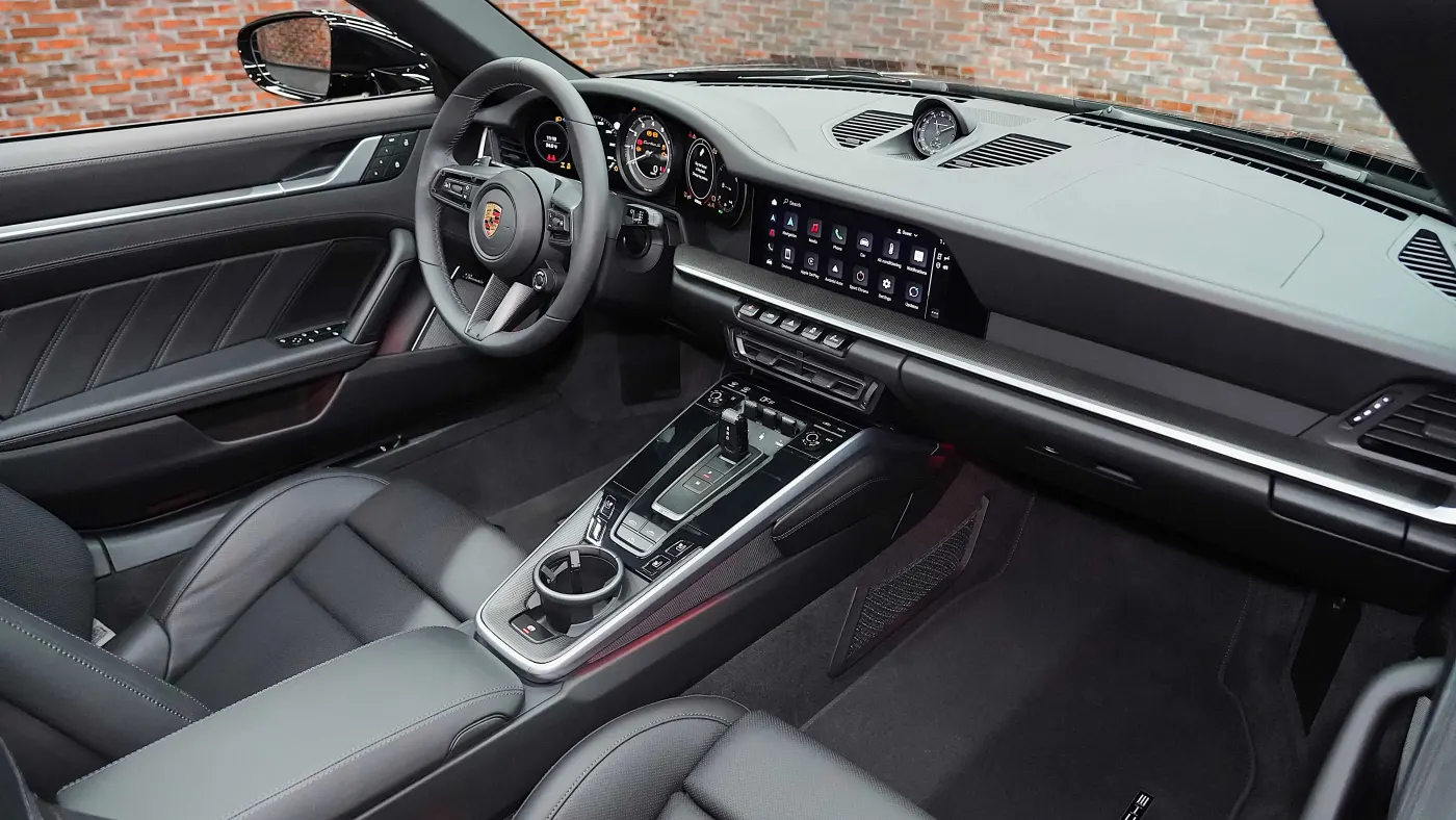 Experience Porsche 911 Turbo S Cabriolet with twin-turbocharged acceleration and open-top design