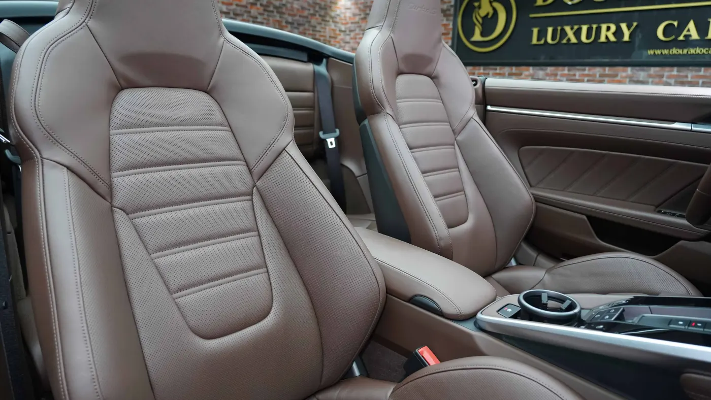 Experience Porsche 911 Turbo S Cabriolet with twin-turbocharged acceleration and open-top design