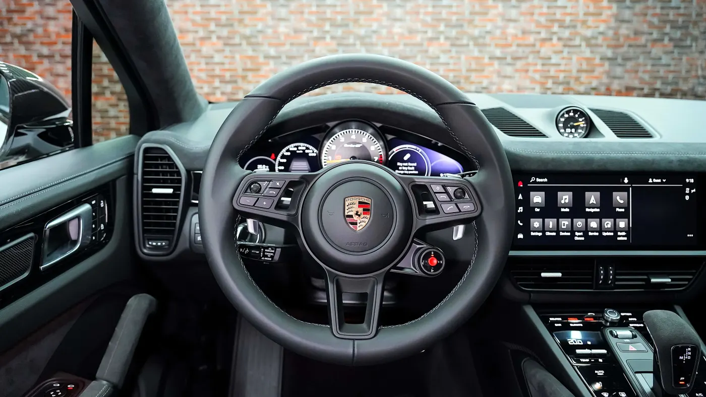 Experience Porsche Cayenne Turbo GT Coupe with twin-turbo V8 dominance and coupe styling