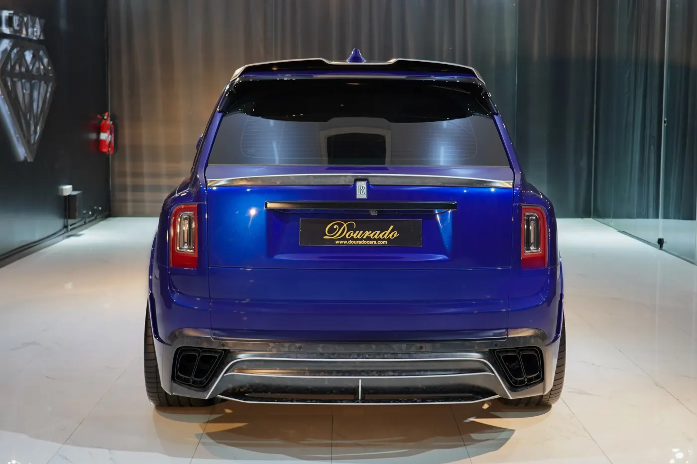 Prestige, effortless V12 power, and unyielding road presence with Rolls-Royce Cullinan by Onyx Concept Deep Salamanca Blue in Dubai